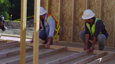 Group of construction workers staning up wall Stock Footage 47527909