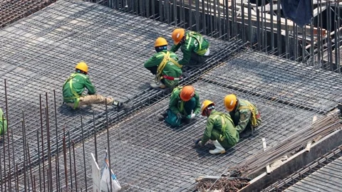 Group of construction workers working on a building framework. Stock Footage 341086057