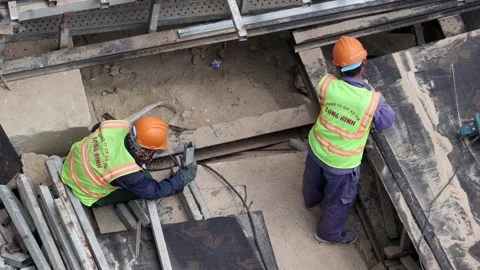 Group of construction workers working on a building framework. Stock Footage 344157076