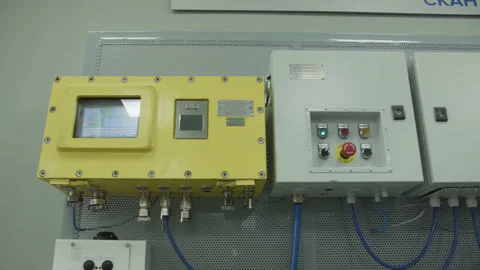 Group of control panels in boxes mounted on wall. Start stop, control screen Stock Footage 205217712