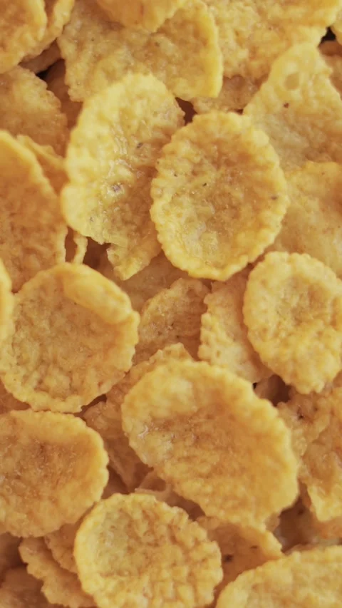 Group of cornflakes in rotation close up. Vertical video. Stock Footage 271071217