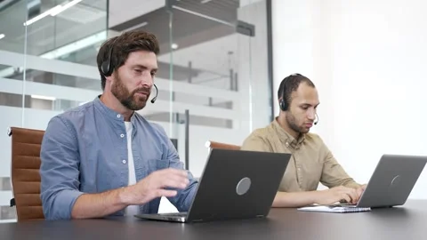 Group of corporate operators working in customer support service on helpline  Stock Footage 303413337