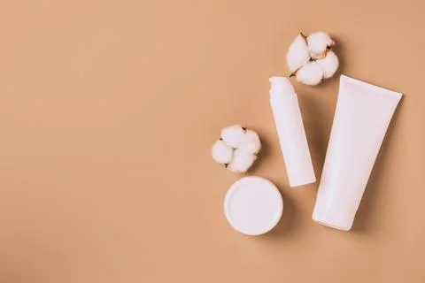 Group of cosmetics various tubes bottles jars modern solid color background Stock Photos