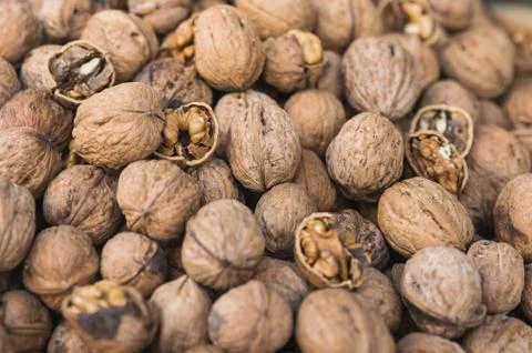 The group of cracked walnuts with selective focus Stock Photos