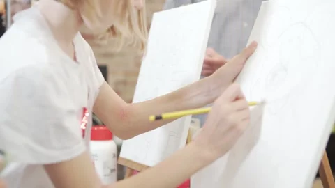 A group is creating art on canvases with hand gestures at the event Stock Footage 274004041