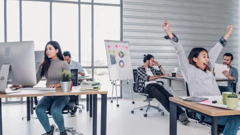 Group of creative designer dancing in office with relax feeling and glad abou Foto stock