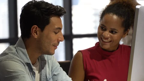 Group of creative designers brainstorming together wiht computer in the meeti Stock Footage 111655522