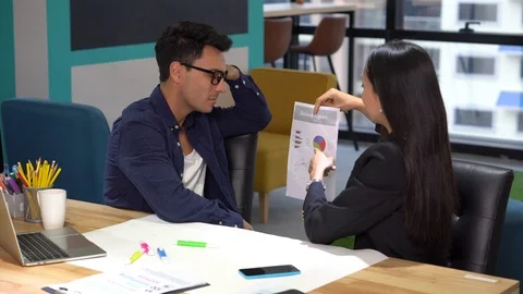 Group of creative designers brainstorming together in the meeting room . Busi Stock Footage 112729610