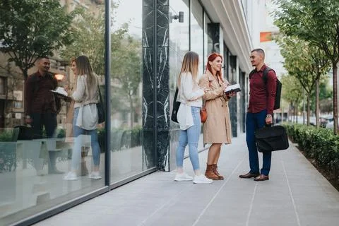 A group of creative friends collaboratively analyzing data and brainstorming Stock Photos