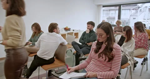 Group of creative people focused on learning and sharing knowledge at a business Stock Footage 273813859