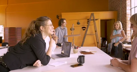 Group of creative professionals discussing their business startup together Stock Footage 88343553