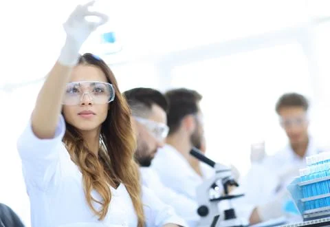 Group of creative scientists working in a laboratory. Stock Photos