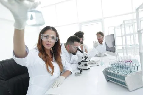 Group of creative scientists working in a laboratory. Stock Photos