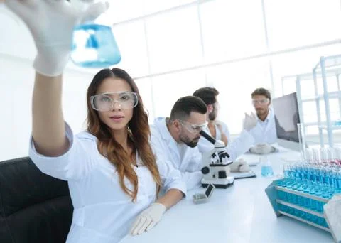 Group of creative scientists working in a laboratory. Stock Photos