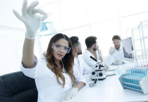 Group of creative scientists working in a laboratory. Stock Photos