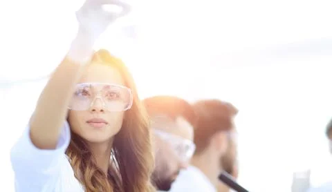 Group of creative scientists working in a laboratory. Stock Photos