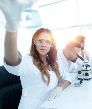 Group of creative scientists working in a laboratory. Stock Photos