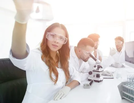 Group of creative scientists working in a laboratory. Stock Photos