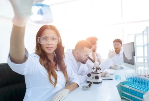 Group of creative scientists working in a laboratory. Stock Photos