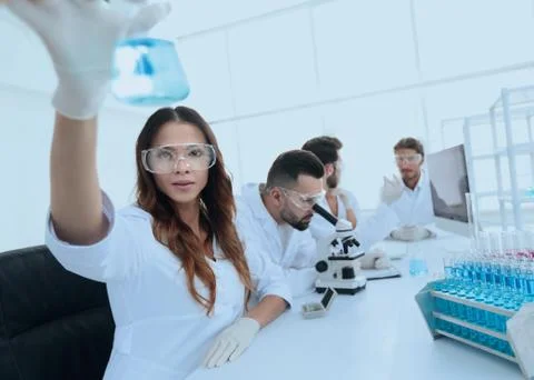 Group of creative scientists working in a laboratory. Stock Photos