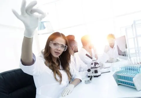 Group of creative scientists working in a laboratory. Stock Photos