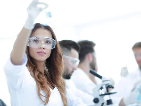 Group of creative scientists working in a laboratory. Stock Photos