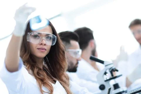 Group of creative scientists working in a laboratory. Stock Photos
