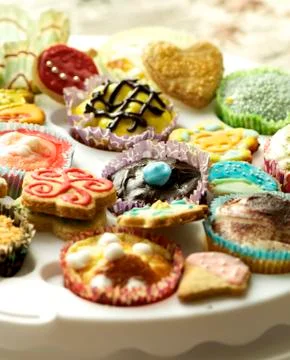 Group of cupcakes and biscuits Stock Photos