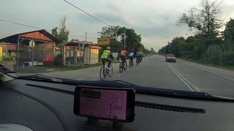 A group of cyclist on road from car dash camera view Video stock 143642575