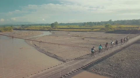 Group of Cyclists crossing the Bridge Stock Footage 146360858