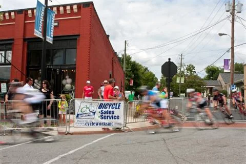 Group of cyclists motion blur in turn of bike race Foto stock