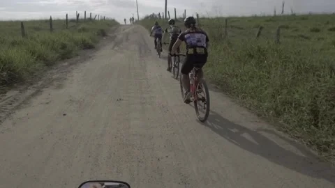 Group of cyclists practicing mountain biking. Donwhill. Stock Footage 216237773