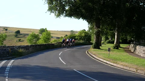Group of cyclists on the road in countryside Видео 200015200