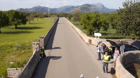 Group of cyclists on a road drone shot Stock Footage 118829157