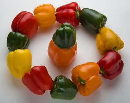 Group of dancing peppers in a circle Stock Photos