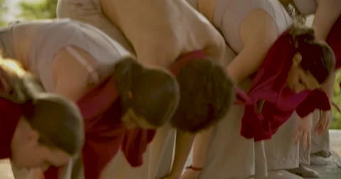 Group dancing, young people doing the wave with tied together clothes, 4k Stock Footage 248233573