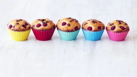 Group of delicious muffins placed on table Stock Photos