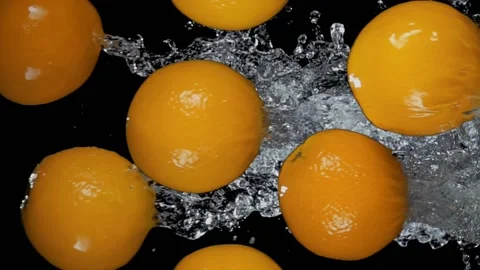 Group of delicious oranges are flying horizontally with water splashes Stock Footage 171767310
