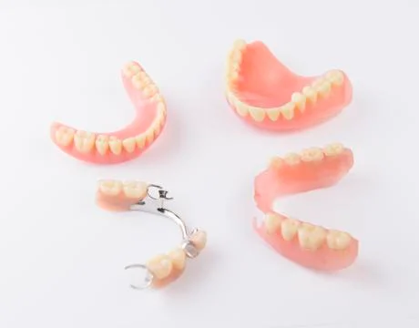 Group of dentures on white background Stock Photos