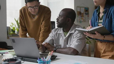 Group of Developers Brainstorming Algorithms Stockbeeldmateriaal 317339836