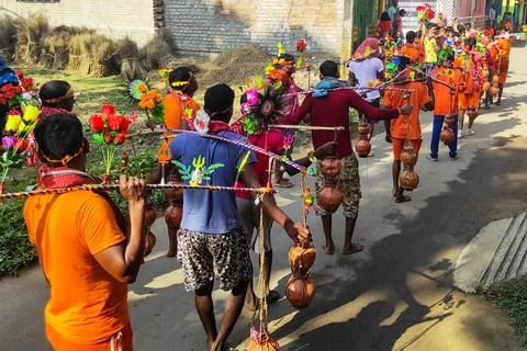 A group of devotees carrying holy Ganges water and going through the village Stock Photos