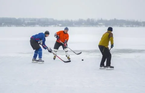 Group of different aged people playing hockey Foto stock
