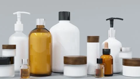 Group of different beige and brown glass and plastic cosmetic bottles and jars Stock Footage 236144242
