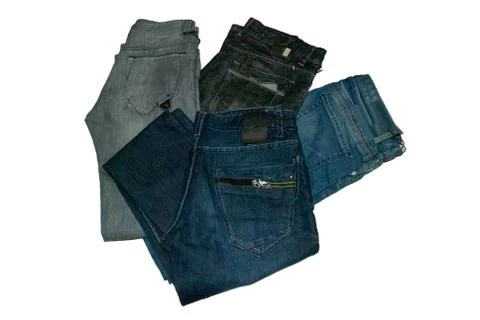 Group of different blue jeans stack isolated on white background. Stock-Fotos