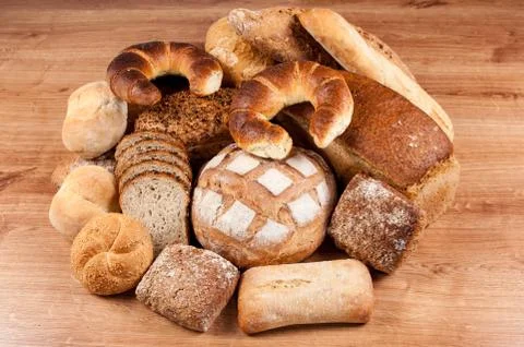 Group of different bread's type on wooden table Stock Photos