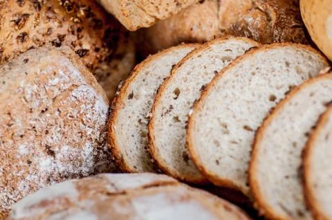Group of different bread's type on wooden table Stock Photos