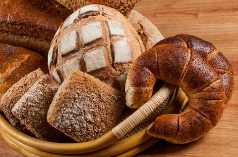 Group of different bread's type on wooden table Stock Photos
