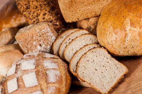 Group of different bread's type on wooden table Stock-Fotos