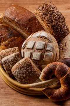 Group of different breads type on wooden table Stock Photos