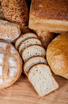 Group of different bread's type on wooden table Stock Photos